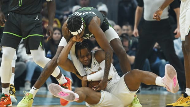 Minnesota Timberwolves forward Jaden McDaniels (3) and Cleveland Cavaliers forward Isaac Okoro (35) fight for possession during the first half at Rocket Mortgage FieldHouse.